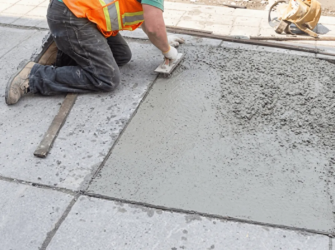Professional repairing a concrete floor in Milwaukee, WI